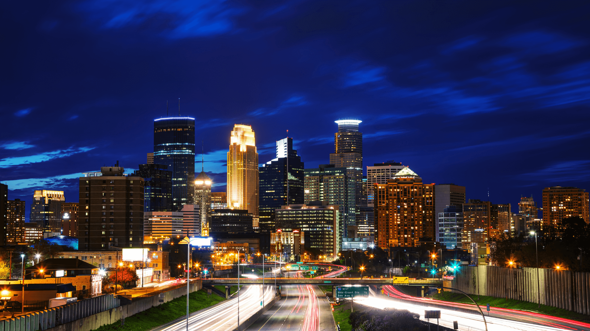 Minneapolis St Paul skyline showing downtown buildings - BomberJacket Networks serves Twin Cities businesses with managed IT services, CMMC compliance, and cybersecurity