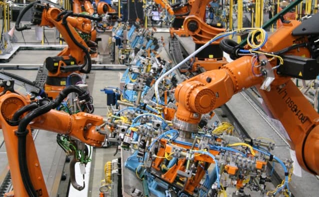 Minnesota manufacturing facility with precision CNC equipment and defense contractor production floor requiring CMMC Level 2 compliance and cybersecurity for controlled unclassified information